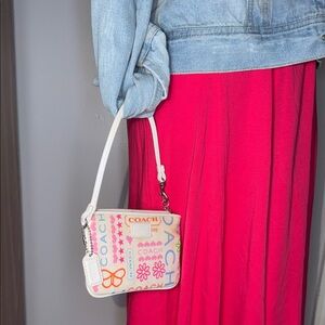 Coach Graphic poppy sm Wristlet.pink, green, blue& orange pink. cream hang tag
